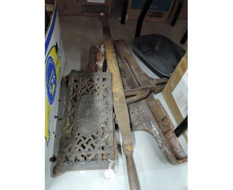 A selection of vintage cast iron fire place parts and slate roof ripper