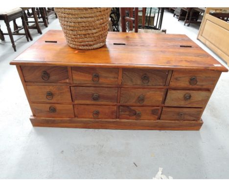 A modern hardwood coffee table/merchants style chest