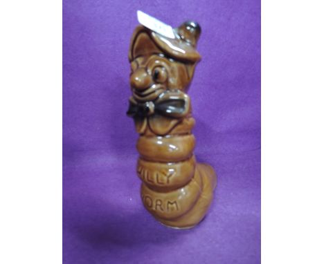 A vintage ceramic Willy Worm money bank