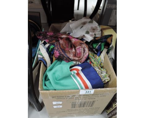 A selection of vintage silk scarf and throws