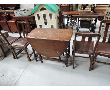 An early to mid 20th Century oak twist gateleg dining table and four chairs