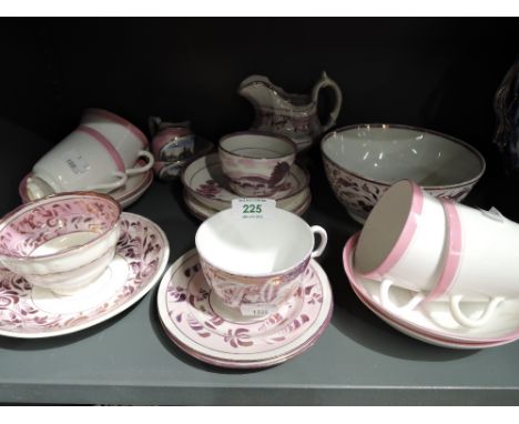 A selection of vintage and antique pink lustre wares including tea cup and saucer and printed Brigg keepsake