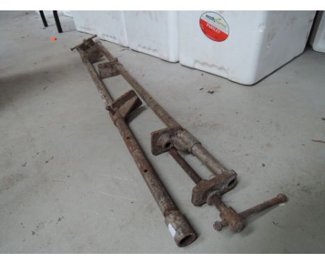 A pair of vintage sash clamps with unusual tube bodys