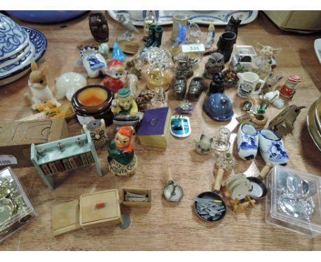 A selection of vintage curios trinkets and figures