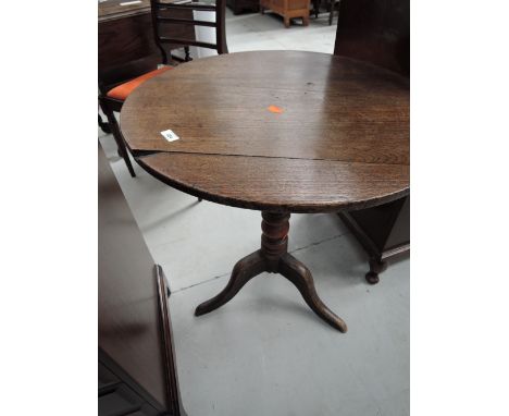 A 19th Century oak pedestal occasional table