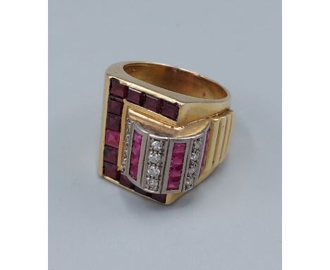 An 18ct gold Diamond and red stone cocktail ring in the form of a buckle, 16.3gms, ring size N