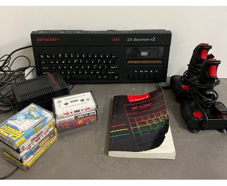 Sinclair Spectrum with games, joy stick and book