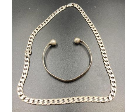 A silver chain and a silver bangle