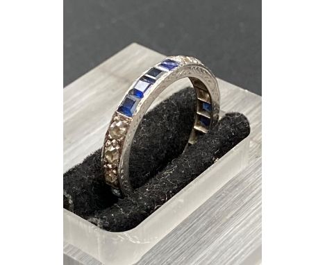 A diamond and sapphire eternity ring.(Size L)