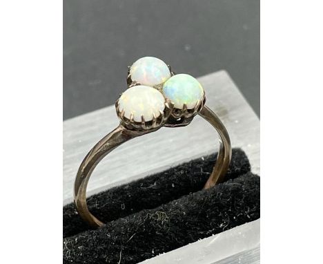 A three stone Opal ring, on untested gold setting. Size S 
