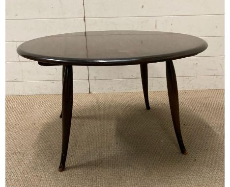 An ercol style Mid Century coffee table on splayed legs (H44cm Dia75cm)