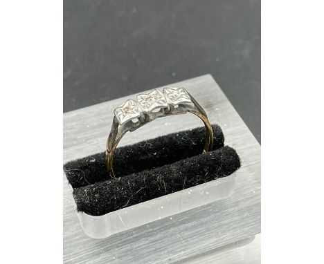 An 18ct gold and platinum setting three stone diamond ring. (Approximate Total Weight 2g) Size P