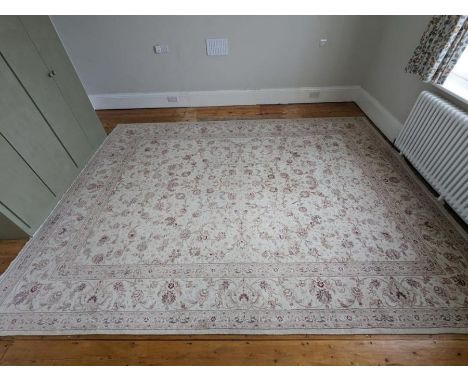 A large floral pattern rug with cream grounds and light pink flowers (350cm x 270cm)