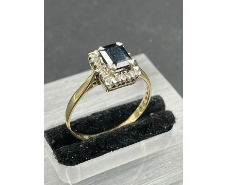 A 9ct gold sapphire and diamond ring. Size R