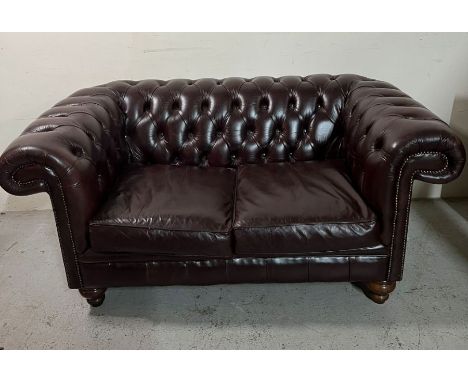 Two seater brown Chesterfield sofa 