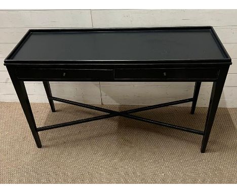 A black console table with cross stretchers and square tapering legs (H78cm W120cm D40cm)