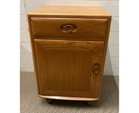 An Ercol single drawer cupboards on castors (H70cm W46cm D44cm)