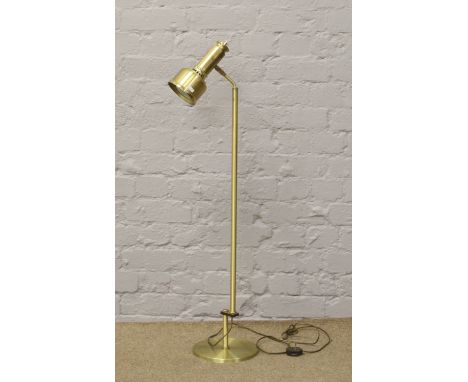 A brushed brass effect floor standing reading lamp.