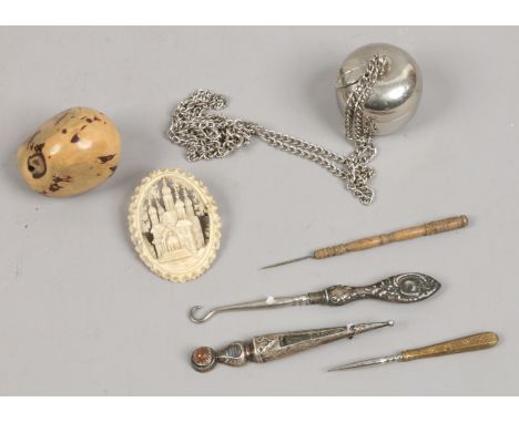 A small group of collectables to include silver, bone brooch, netsuke etc.