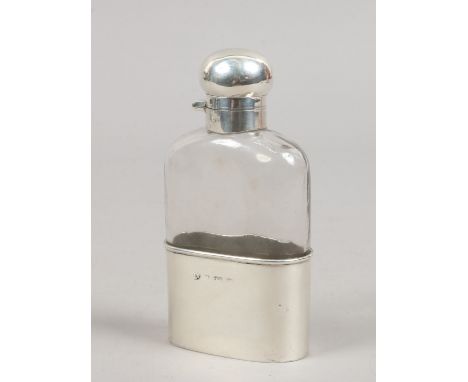 An Edwardian silver mounted glass hip flask, assayed Birmingham 1902.