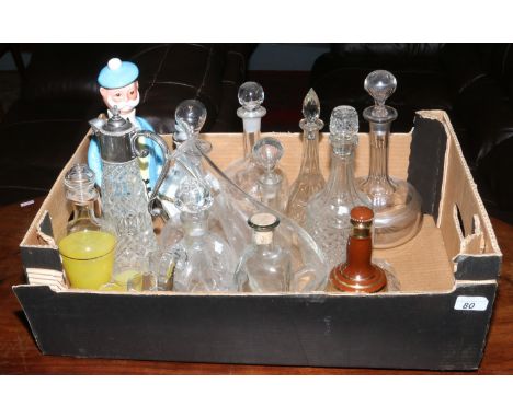 A box of glass and ceramic decanters.