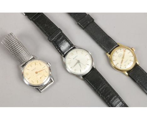 Three vintage wristwatches including manual examples one on bracelet strap.