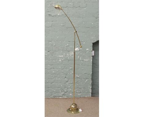 A brass effect anglepoise standard lamp.