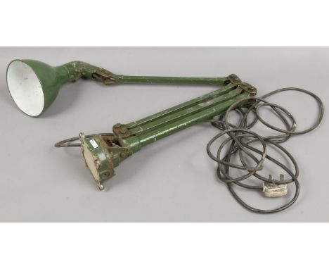 A vintage cast iron machinist / engineers industrial bench lamp and with bottle green enamel shade.