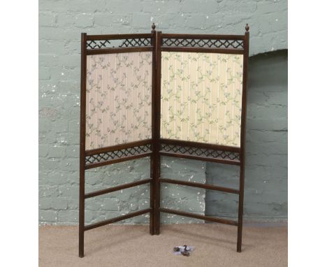 A mahogany bi-fold screen.