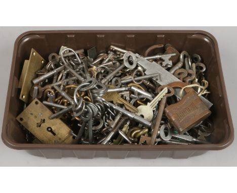 A box of vintage keys and locks.