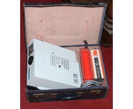 A Gnome Supreme QI 35mm photo slide projector in carry case with instruction manual.