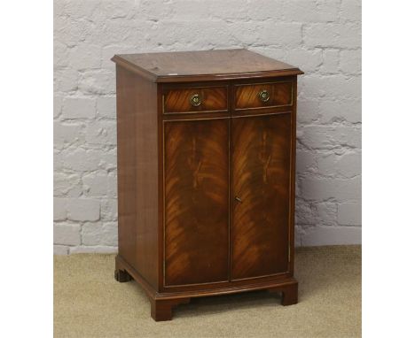 A mahogany bow front hifi cabinet raised on bracket feet with key.