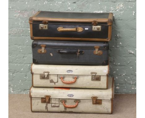 Four vintage suitcases to include two Vanguard examples.