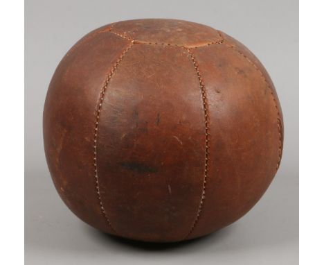A vintage leather medicine ball.