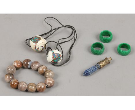 Three spinach jade rings, a hardstone bead bracelet, a Lapis Lazuli pendant and two bone pendants.