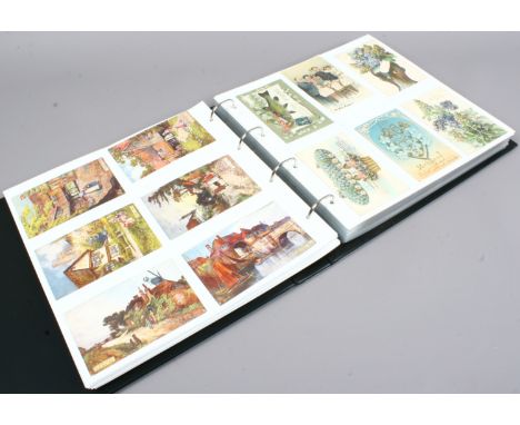 A large album of early 20th century and vintage postcards including monochrome, humorous and illustrated examples.