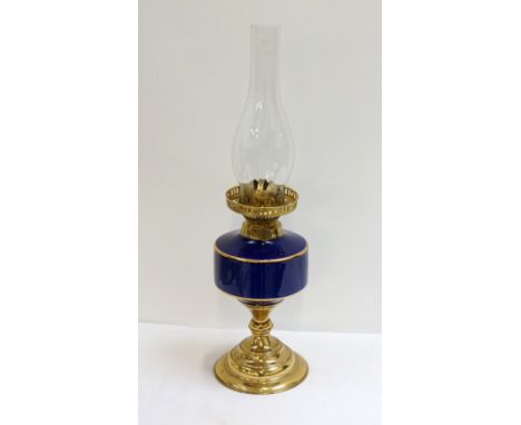 DUPLEX OIL LAMP
with an opaque glass shade decorated with a pheasant, a brass body with a blue glass reservoir and clear glas