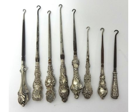 Collection of eight silver handled antique button hooks