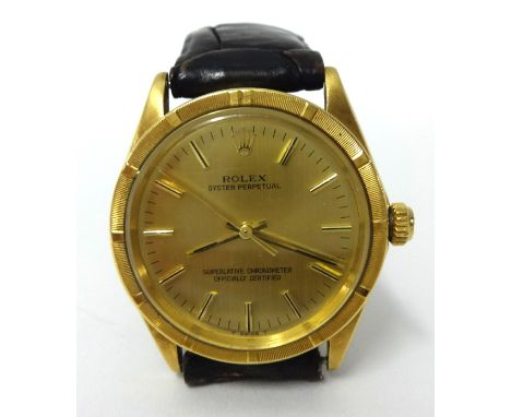 A Gents 18ct gold wrist watch, Oyster Perpetual Chronometer with croco Rolex strap, having baton numerals in working order