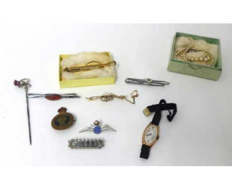 A mixed lot including 9ct gold wrist watch with stylish face, brooches, Scottish Amethyst hat pin, a gilt metal tie clip, an 