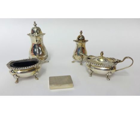 A four piece similar condiment set and a small silver snuff box (5)