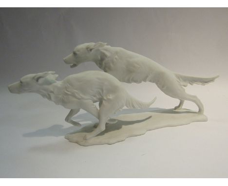A Kaiser poreclain matt white figure of hounds running, model no. 420, together with a Country Artist figure of an elephant, 