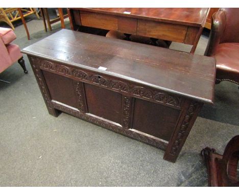 A circa 1760 oak three panel coffer with carved decoration and internal candle box over stile feet, 105cm wide x 55cm tall x 