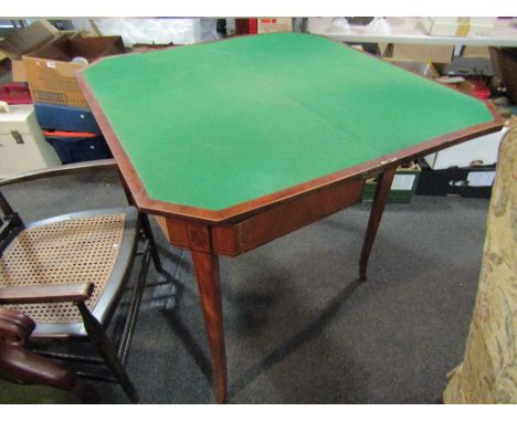 A 19th Century flame mahogany card table, the crossbanded top over canted corners to outswept legs