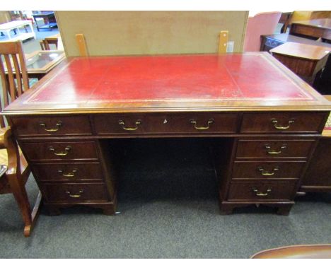 In the manner of 'Bevan Funnell' a George III style flame mahogany twin pedestal writing desk the gilt tooled leather insert 