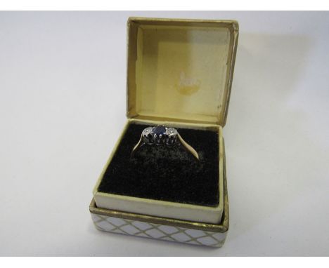 An 18ct gold platinum set diamond and sapphire ring, size R/S, 2.3g