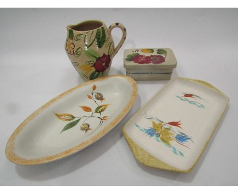 Four pieces of Radford pottery, butter dish, oval dish, sandwich tray and water jug, various designs