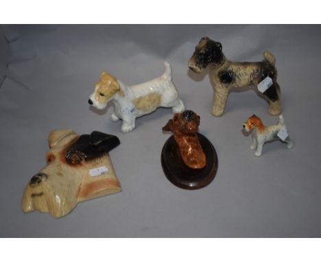 A selection of dog related ceramics, including chalk ware wall hanging terrier, ceramic terrier mounted on wood plaque, and t