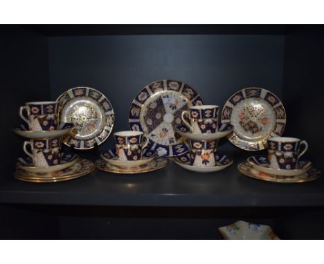 A collection of Royal Crown Derby style tea wares in the Imari palette, cups , saucers and plates to be included.