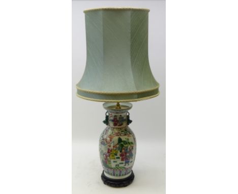 20th century Chinese Famille Verte baluster shaped table lamp with dog of fo handles, painted panels of figures and foliage o